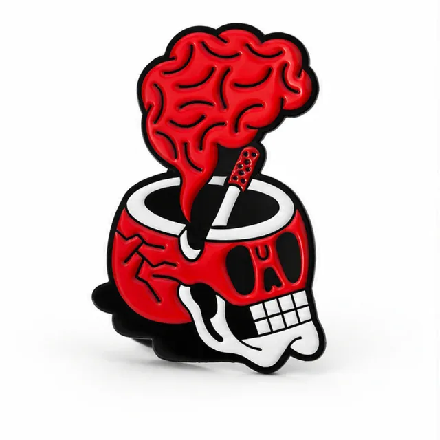 Red skull enamel pin with white teeth, a black bowl and red brain-shaped smoke on a plain white background.